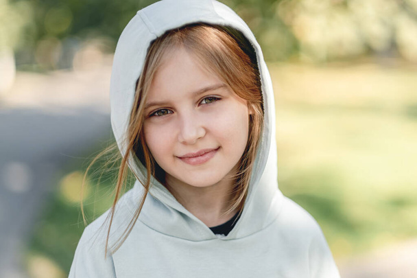 Portrait of happy little girl in hoodie - Fotografie, Obrázek