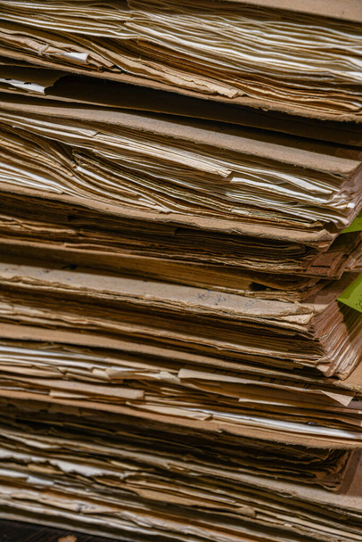 A large old pile of archival papers and folders. - Photo, Image