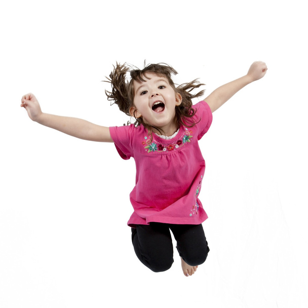 Happy little girl jumping in air - Photo, image