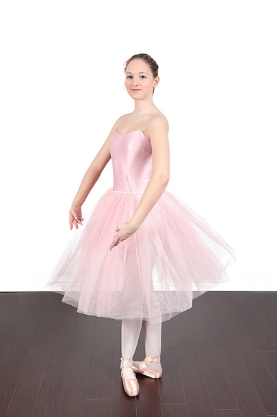 Ballerina dancing in studio - Photo, image