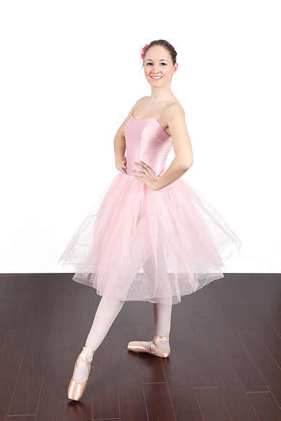 Ballerina dancing in studio - Фото, изображение