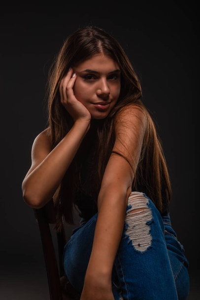Beautiful and attractive girl is posing while making a seductive face - Zdjęcie, obraz