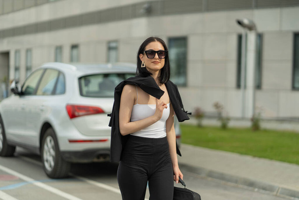 Businesswoman is walking towards her company - Zdjęcie, obraz