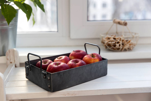 Six red apples on a zinc gray tray to eat on a white wooden table. - Fotoğraf, Görsel