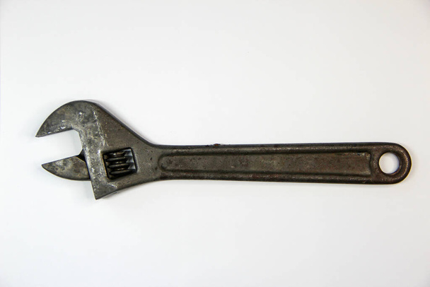 Регулируемый гаечный ключ на белом фоне - Фото, изображение