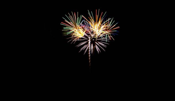 Festive fireworks on black background. Colorful celebration. Copy space. - Foto, Imagem