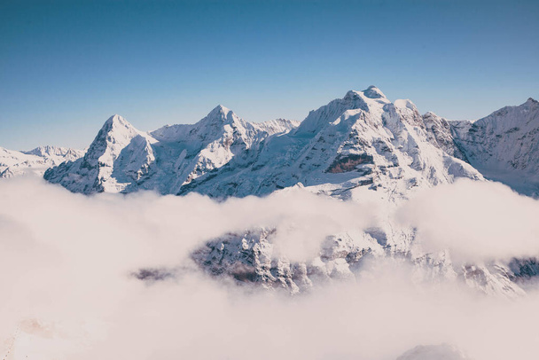 amazing snow covered peaks in the Swiss alps Jungfrau region from Schilthorn - Photo, Image