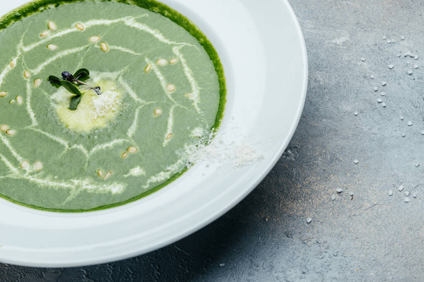 Delicious broccoli cream soup with parmesan in a bowl, . Vegetarian dish. banner, catering menu recipe place for text, top view. - Fotó, kép