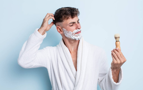 handsome hispanic man shaving with foam - Fotó, kép