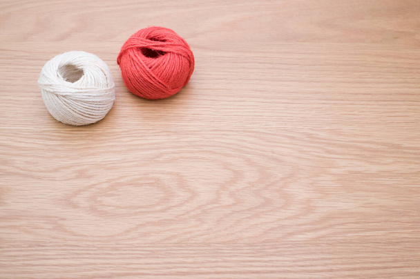 rough cotton decorative yarn on a wooden background with text space - 写真・画像