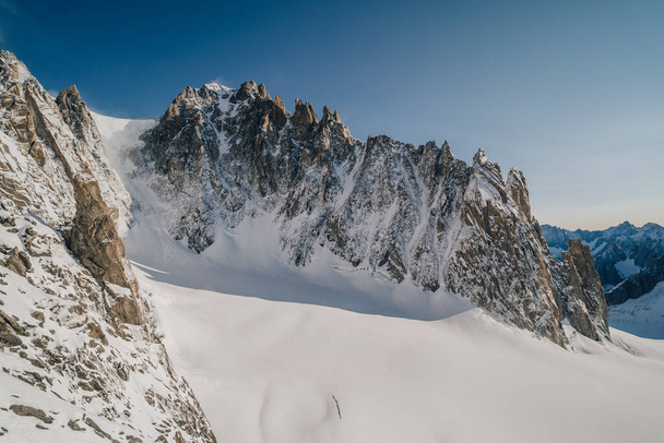 Arete du Diable, famous alpine climb and adventure ascent. Big granit rocky ridge with rock towers, glacier, snow and ice. - Fotografie, Obrázek