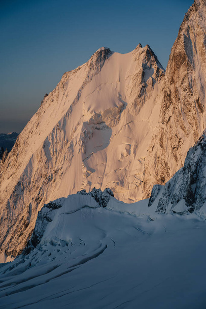 Alpine landscape, wall of ice and snow during sunrise. - Valokuva, kuva