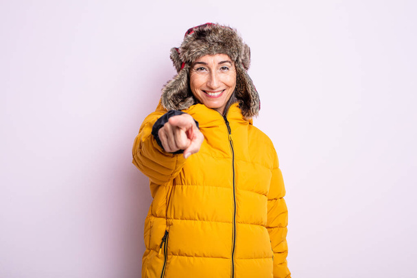 senior pretty woman pointing at camera choosing you. winter concept - Valokuva, kuva