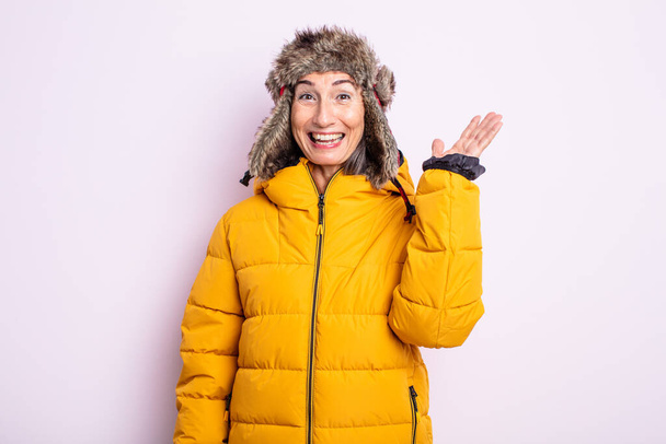 senior pretty woman feeling happy, surprised realizing a solution or idea. winter concept - Valokuva, kuva