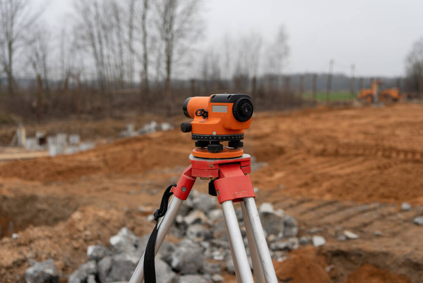 Photograph of a level at a construction site. construction in the background - Foto, Imagen