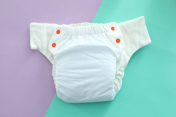 Reusable diapers on two-color background, close up - Photo, Image