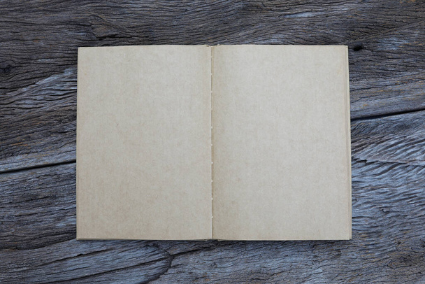 Opened notebook on grunge wooden table flat lay top view - Foto, Imagem