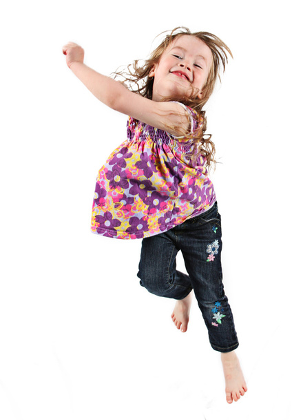 Happy little girl jumping in air - Fotó, kép