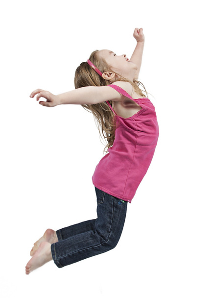 Happy little girl jumping in air - Zdjęcie, obraz