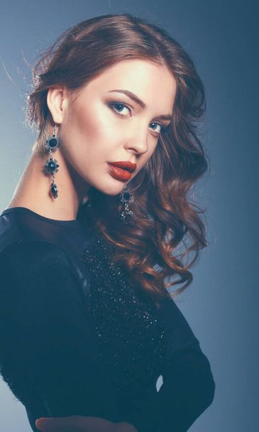 Beautiful woman with evening make-up in black dress - Foto, immagini