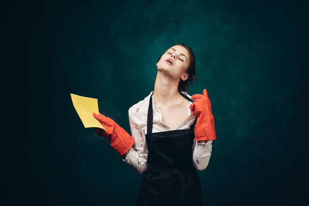cleaning lady in red rubber gloves with a rag in her hands housekeeping - Photo, image
