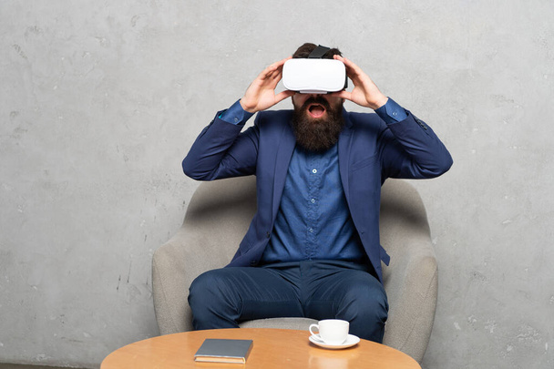 Lets go virtual. Shocked man director wear VR headset. Using virtual reality in future business - Foto, Imagem