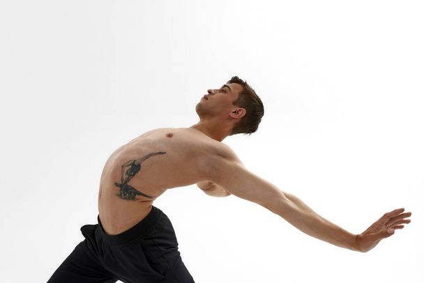 Man dancing ballet dance on white background - Valokuva, kuva