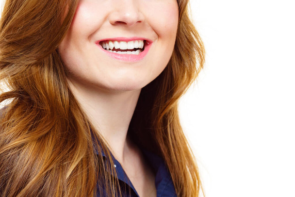 Young smiling woman with long healthy brown hair - Фото, изображение