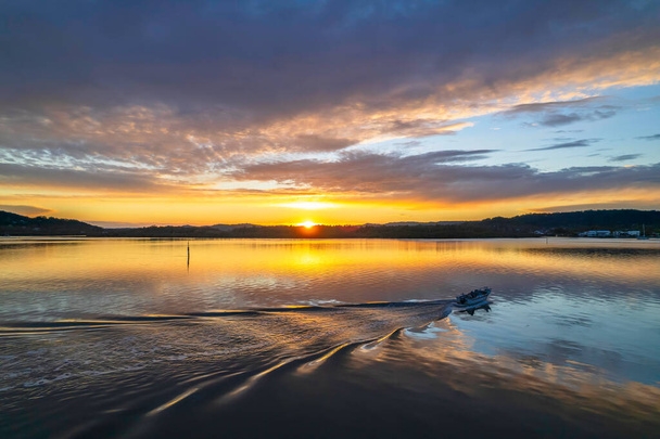 Sunrise, cloud and reflections at Woy Woy Waterfront on the Central Coast, NSW, Australia. - Zdjęcie, obraz