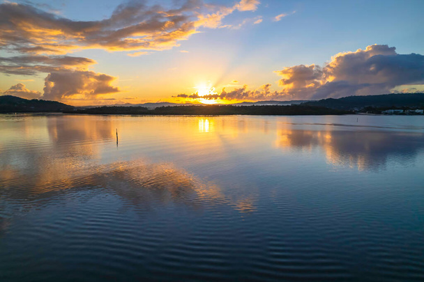 Sunrise waterscape with clouds and reflections at Woy Woy Waterfront on the Central Coast, NSW, Australia. - Fotografie, Obrázek
