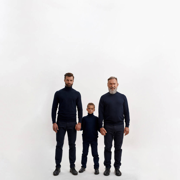 Portrait of three generations of Caucasian men in white studio - Φωτογραφία, εικόνα