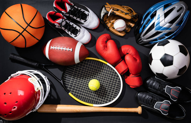 High Angle View Of Various Sport Equipment On Black Background - Zdjęcie, obraz
