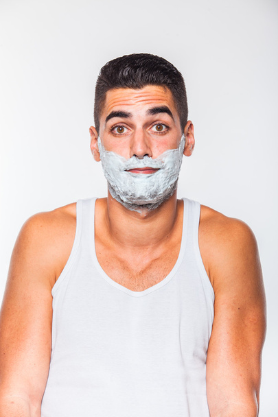 handsome man with shaving cream - Фото, зображення