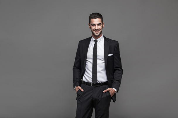 handsome elegant man on grey background - Foto, Imagem