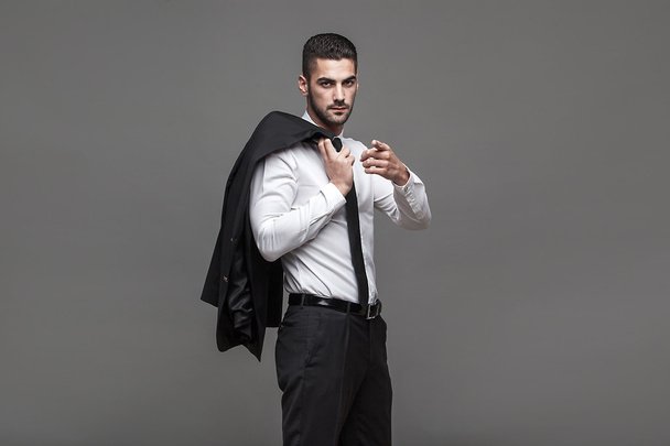 handsome elegant man on grey background - Fotografie, Obrázek