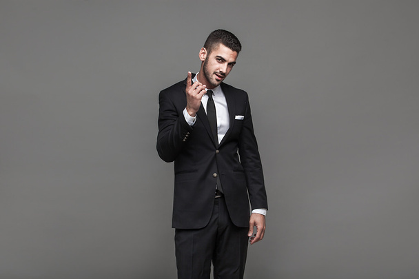 handsome elegant man on grey background - Photo, image