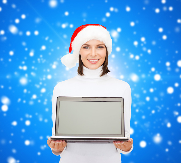 woman in santa helper hat with laptop computer - 写真・画像
