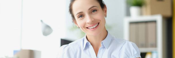 Beautiful smiling woman holding document letter in hands closeup - Photo, Image