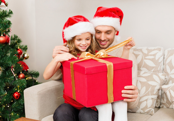 smiling father and daughter opening gift box - Fotó, kép