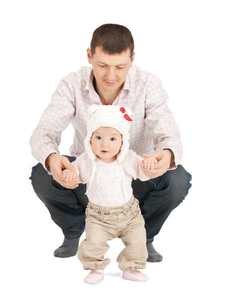 Baby making first steps with father help - Foto, imagen