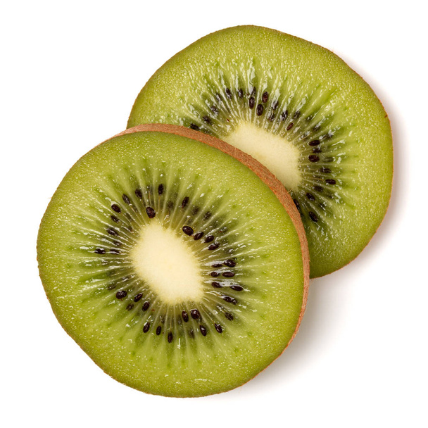 Two kiwi fruit slices isolated on white background closeup. Kiwifruit slices flatlay. Flat lay, top view. - Foto, Imagen