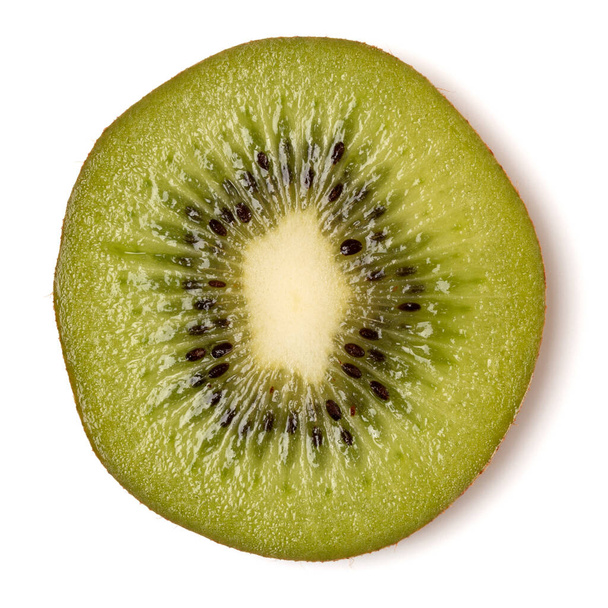 One kiwi fruit slice isolated on white background closeup. Kiwifruit slice flatlay. Flat lay, top view. - Foto, Imagen