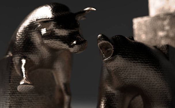 Estatuillas de toro y oso hechas de cobre que representan gráficos económicos de tendencia ascendente y descendente que se acercan entre sí sobre un fondo débilmente iluminado - 3D render - Foto, imagen