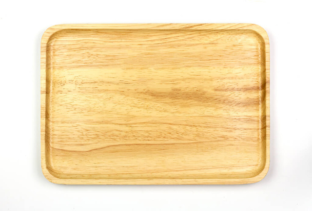Empty square wooden plate isolated on white background, Top view. Plate made of wood. Exquisite tableware. - Фото, изображение