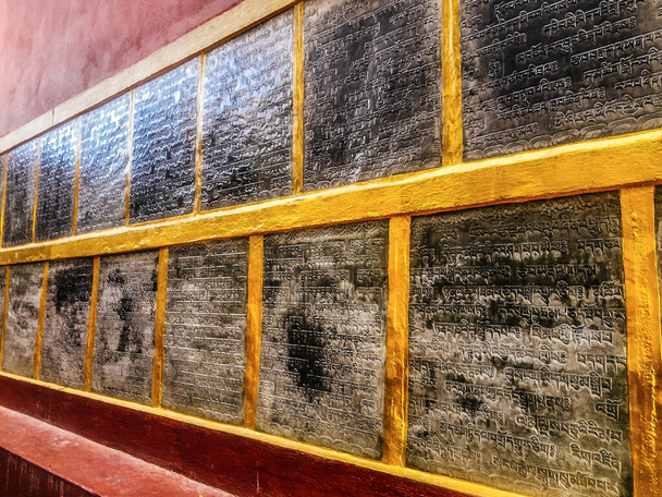 An ancient Buddhist text in Sanskrit etched into a stone tablet at Swayambhunath - Photo, Image