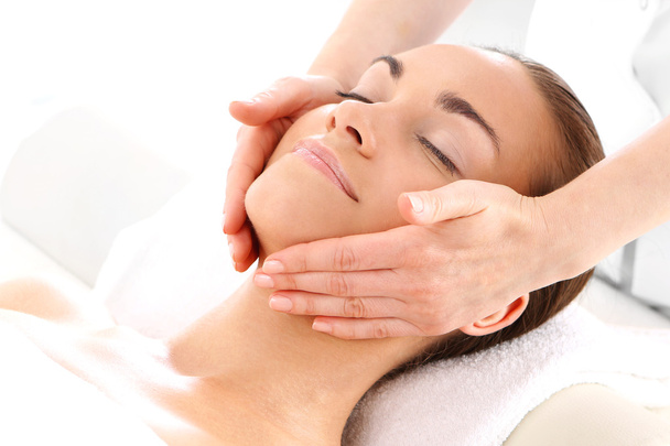 Beautician beautiful woman massaging her temples - Foto, immagini