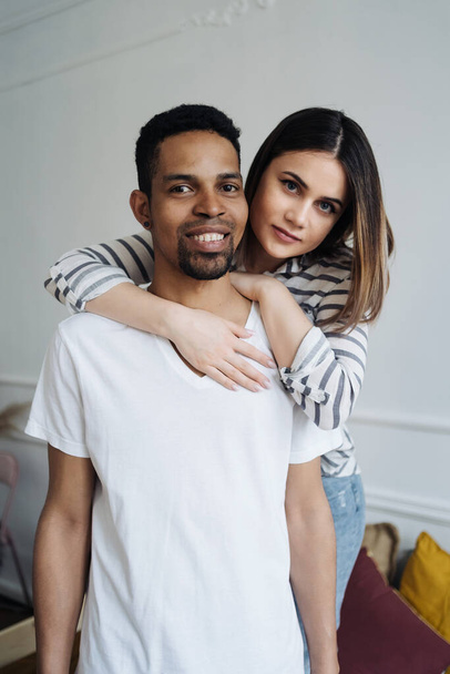 Beautiful mixed race couple portrait at home - Photo, Image