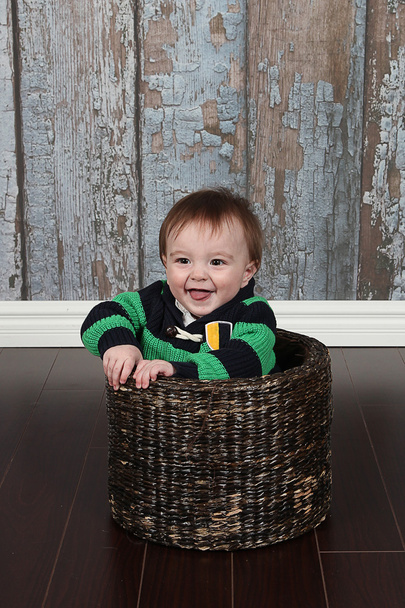 Little Boy in basket - Foto, afbeelding