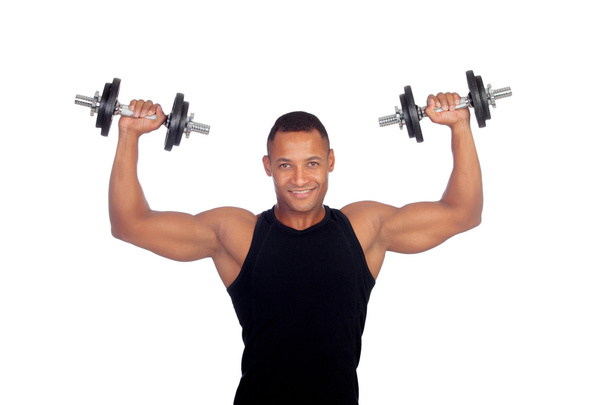 Komea lihaksikas mies harjoittelu käsipainoilla
 - Valokuva, kuva