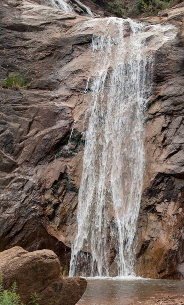 A vertical shot of a small waterfall - Fotó, kép